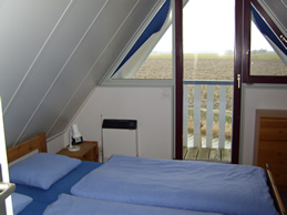 Schlafzimmer oben im Ferienhaus am Lauwersmeer